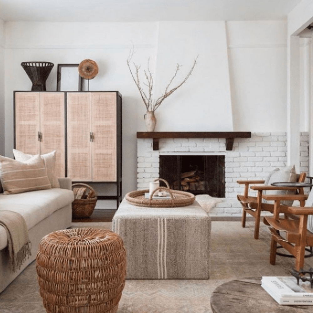 Cane cabinetry and a whitewashed brick hearth.