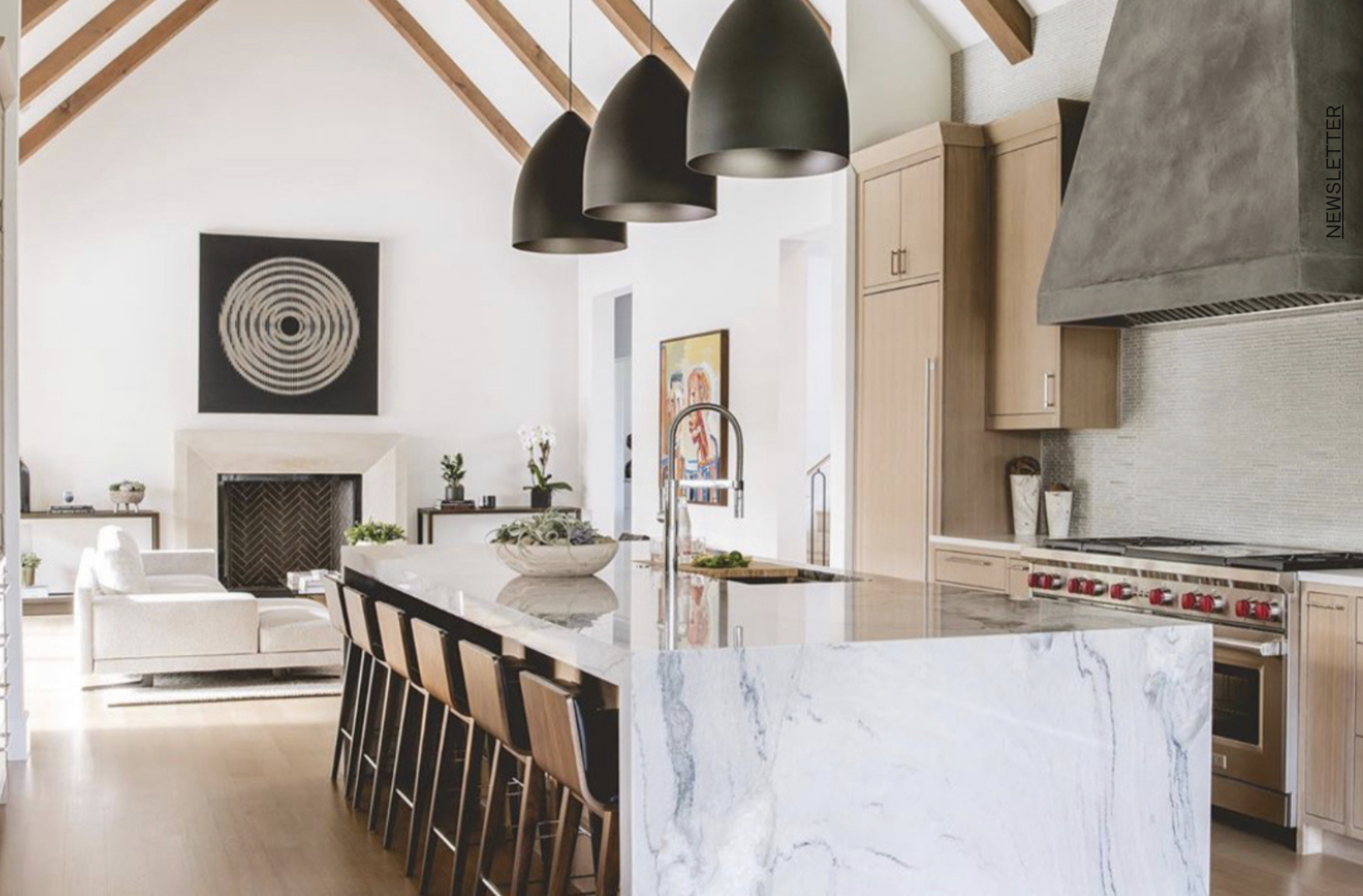 Parisian influenced living room with herringbone floors and marble fireplace
